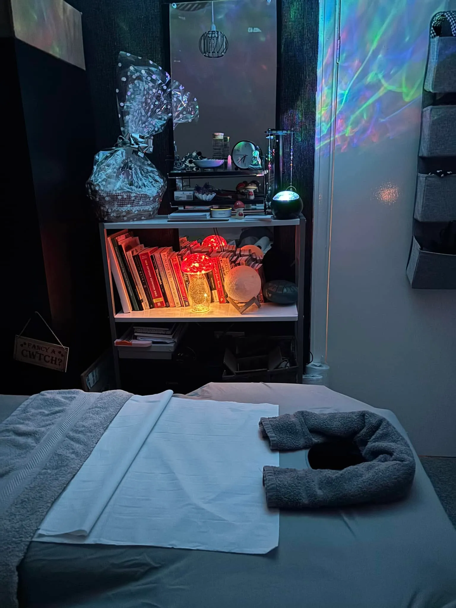 The SpiritSpud treatment room with a made-up massage couch and soft, low lighting